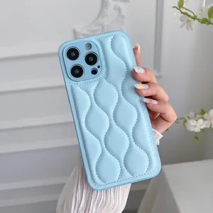 Detail of light blue quilted puffer case with wavy patterns for iPhone 16 Pro Max