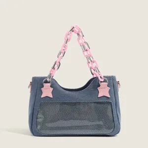 Y2K denim shoulder bag with pink star patch and acrylic chain strap on white background