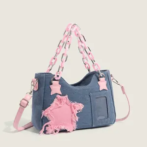 Blue denim handbag with pink star patch and acrylic chain strap for women