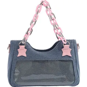 Denim shoulder bag with white mesh window and pink star-shaped chain straps