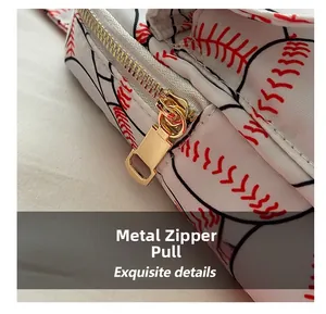 Close-up of the durable golden hardware zipper pull on a baseball pattern nylon bag