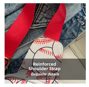 Close-up of the reinforced red shoulder strap on a baseball print nylon chest bag