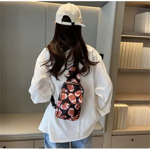 Rear view of a stylish nylon chest bag with rugby football print on a female model.