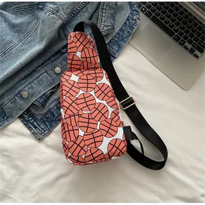 Detailed view of a durable nylon chest bag featuring a trendy basketball print pattern
