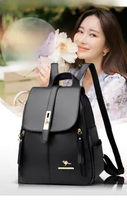 Close-up detail of black leather backpack with elegant gold-tone kangaroo logo