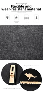 Detailed macro view of black pebbled leather texture and polished gold hardware on backpack