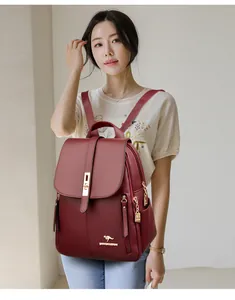 Elegant wine red leather backpack for women shown being worn by an Asian model style
