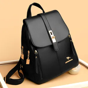 Elegant black leather women's backpack featuring gold hardware and logo details
