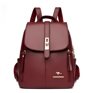 Elegant wine red pebbled leather backpack for women featuring gold kangaroo logo detail