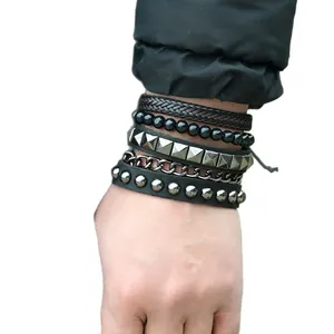 Retro multi-layer woven leather bracelet set featuring metal studs and beads on wrist