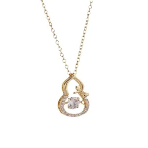 Elegant gold titanium necklace with a dancing wulu pendant and pavé crystals