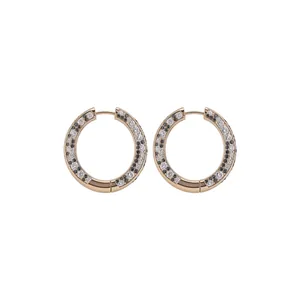 Rose gold hoop earrings featuring black and white cubic zirconia in leopard pattern.