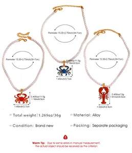 Detailed view showing dimensions of red and blue enamel crab and lobster pendant necklaces