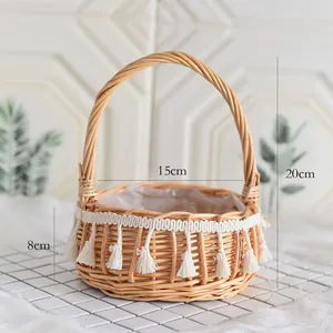 Detailed view of the handmade woven willow basket showing dimensions and tassel trim