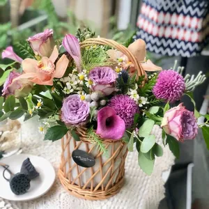 Handcrafted rattan flower basket with handle for floral arrangements and home decor