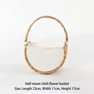 Handwoven half-moon wicker flower basket with white fabric liner and sturdy handle