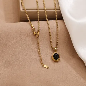 Vintage gold rope chain necklace with elegant oval black cat's eye stone pendant