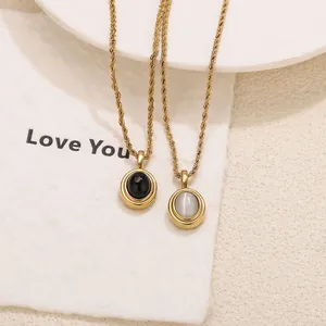 Elegant vintage gold-plated oval cat eye stone and black gem pendant necklace set