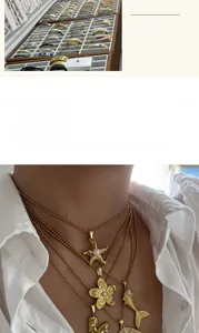 Layered 18K gold plated titanium steel necklaces with starfish and flower pendants