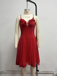 Elegant red evening dress featuring 3D floral detail and a deep V-neck on a mannequin