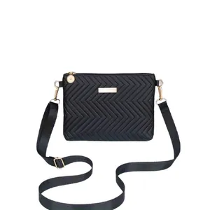 Elegant black quilted crossbody bag with gold hardware and V-pattern chevron stitching