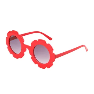 Adorable red sunflower-shaped sunglasses for kids, perfect for cute photo sessions