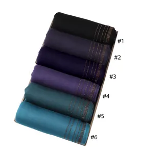 Detail view of cotton jersey hijabs in six colors with sparkling gold diamond rows