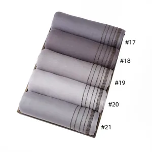 Detailed view of breathable jersey scarves with rhinestone stripes in five grey shades