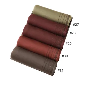 Detailed view of soft mercerized cotton scarves with elegant vertical diamond patterns