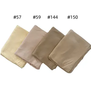 Close-up of four soft jersey cotton diamond scarves in gradient earth tones