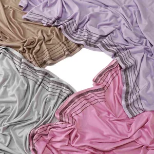 Elastic jersey diamond scarves in four soft colors with rhinestone edge detailing