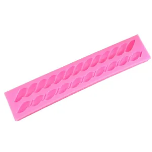 Pink silicone mold with twisted rope and chain patterns for fondant and chocolate cake decorating