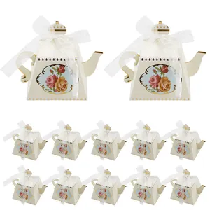 Elegant teapot-shaped wedding candy boxes with gold foil and vintage floral design