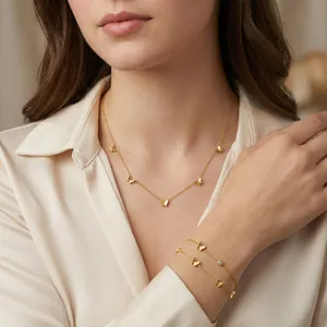 Élégant ensemble de collier et bracelet papillon doré pour femmes en acier inoxydable