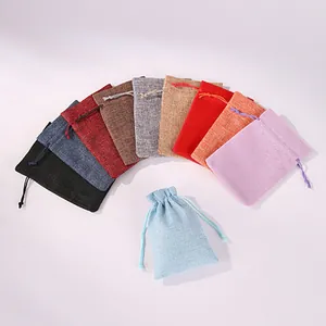 Assorted colorful linen drawstring pouches for jewelry storage and gift packaging