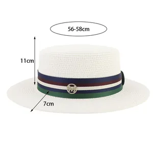 Detail view of white flat-top boater hat showing 56-58cm head size and M logo