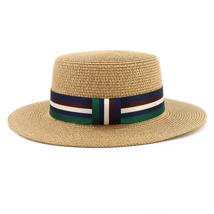 Close-up of the natural woven boater hat with a decorative multi-color striped ribbon
