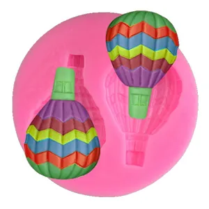 Pink silicone mold featuring two hot air balloon cavities for DIY fondant cake decoration
