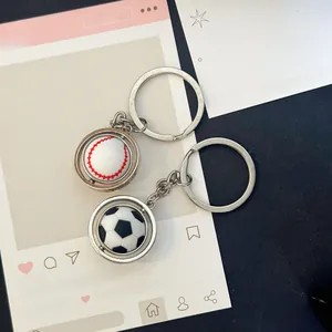 Rotating baseball and football sports keychains with shiny metallic finish and swivel detail