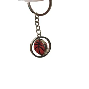 Rotating basketball keychain with textured orange ball and polished metal ring
