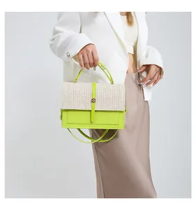 Stylish lime green woven patchwork crossbody bag for women, shown in a fashion detail shot.