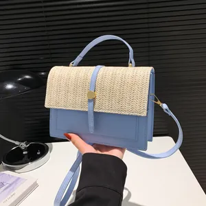 Elegant light blue and straw woven patchwork crossbody bag for stylish summer women