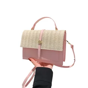 Fashionable summer pink woven patchwork crossbody bag for women with straw flap detail
