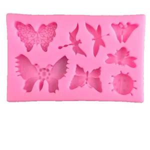 Pink silicone mold featuring butterflies and dragonflies for fondant cake decoration