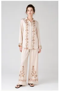 Elegant champagne satin pajama set for women with intricate floral embroidery details