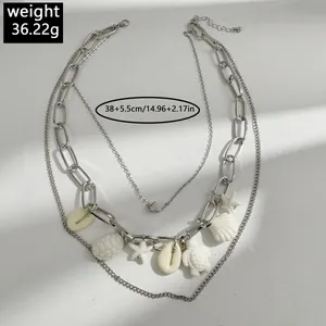 Bohemian silver layered necklace with shell starfish and turtle charms for women