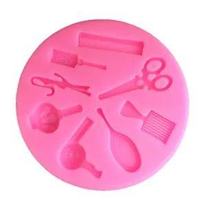 Pink silicone hairdressing tool mold featuring scissors and dryer for cake decor