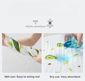 Detail view of highly absorbent cotton gauze baby towel with cute fruit prints