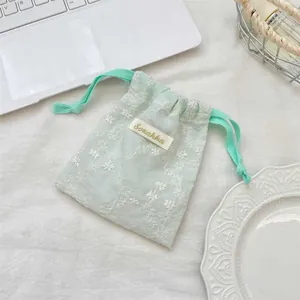 Pochette à cordon en dentelle florale vert clair pour cosmétiques et petits bijoux