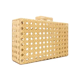 Detailed macro view of a vintage rattan woven acrylic evening clutch bag with clasp